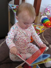 Emma reading her books.