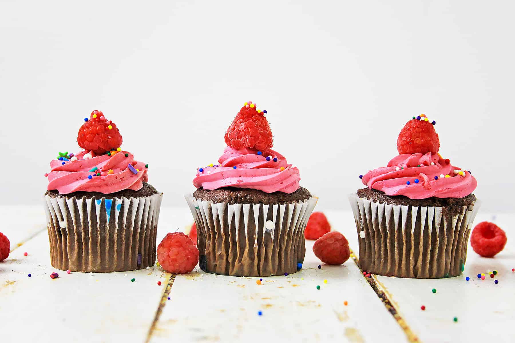 Three raspberry cupcakes