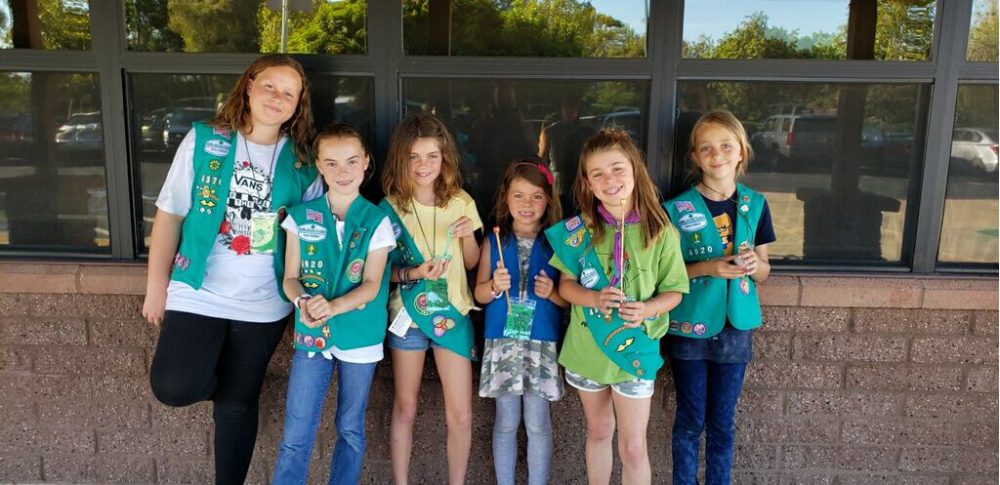 Girl Scouts make wands at a Harry Potter event