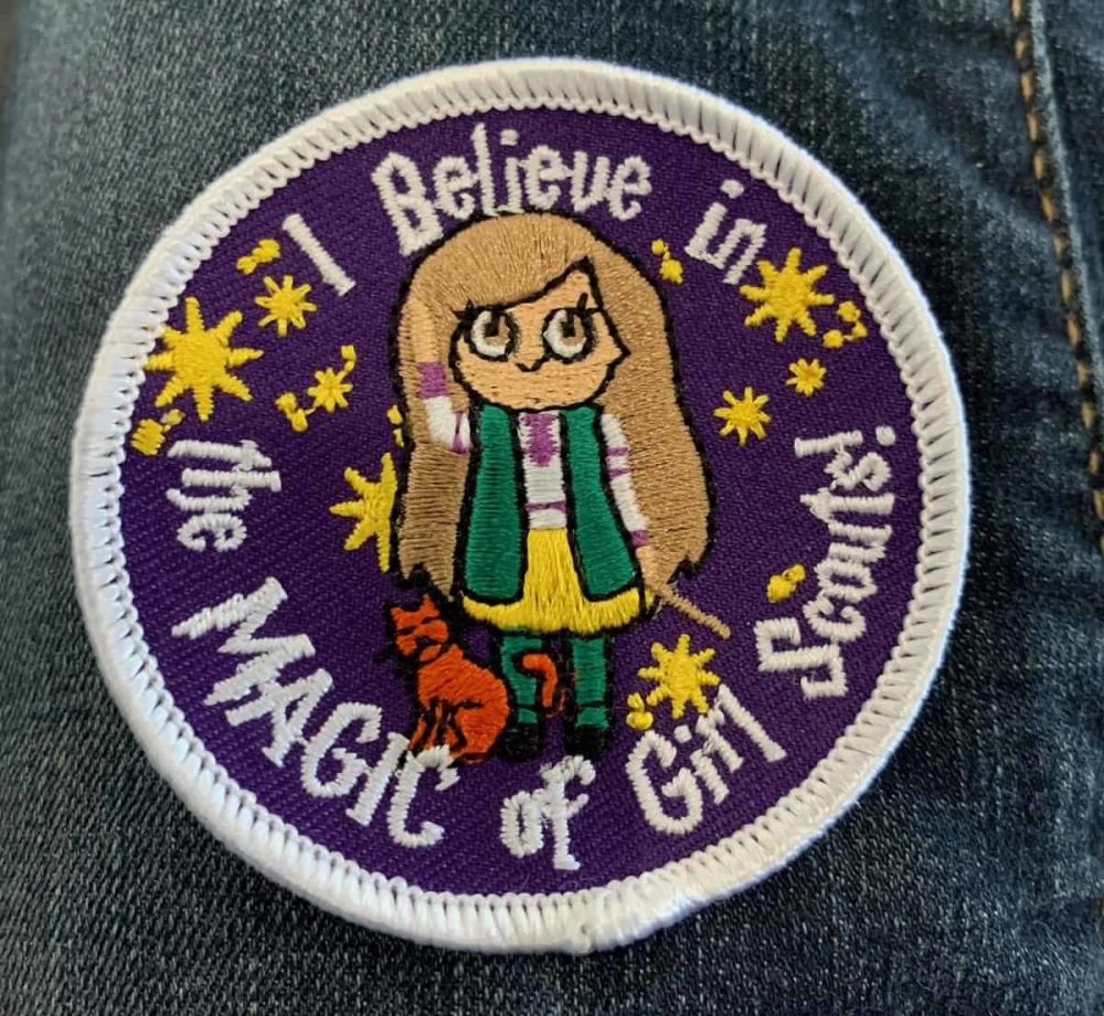 Custom patch reading "I believe in the MAGIC of Girl Scouts!"