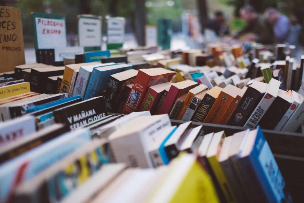 Books for sale at a yard sale. 