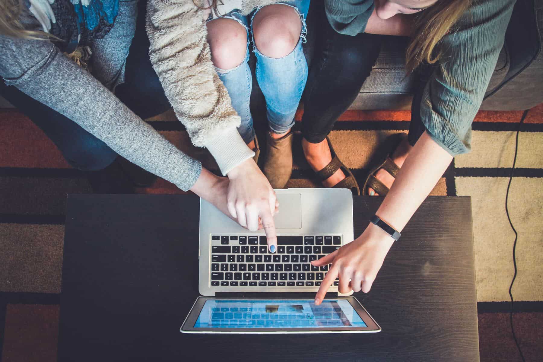 group of people around laptop